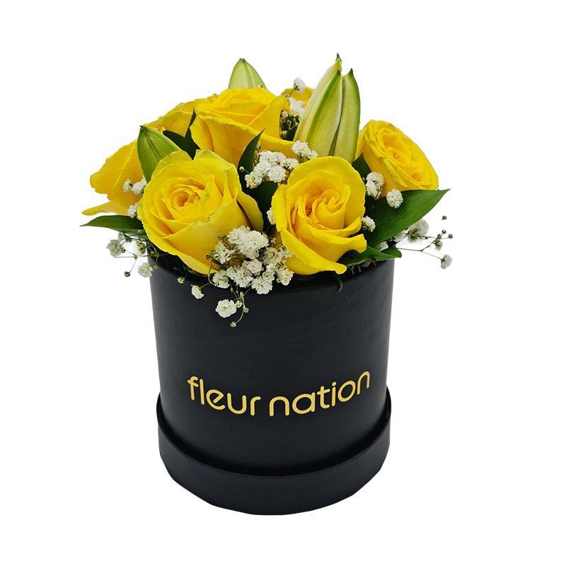 Standard Black Hat Box - Yellow Roses with Lilies - Fleur Nation - flowers, chocolates, cakes and gifts same day delivery in Dubai
